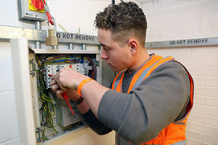 Student working in the electrical workshop